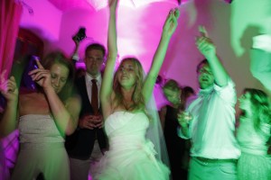 Bride and guests dancing at the wedding party