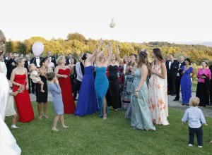 Bride and guests during the bridal bouquet toss