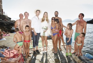 Bridal couple and guests on the beach
