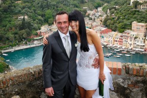 Couple in Portofino after a civil wedding on the castle Brown