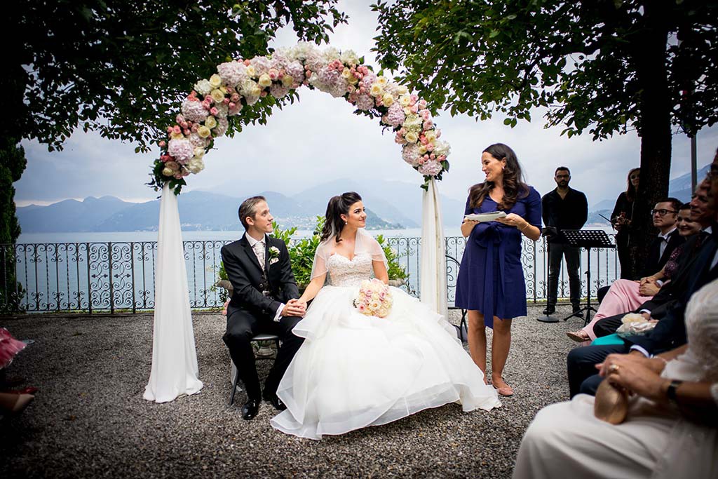 Bride and groom during wedding ceremony on Lake Como