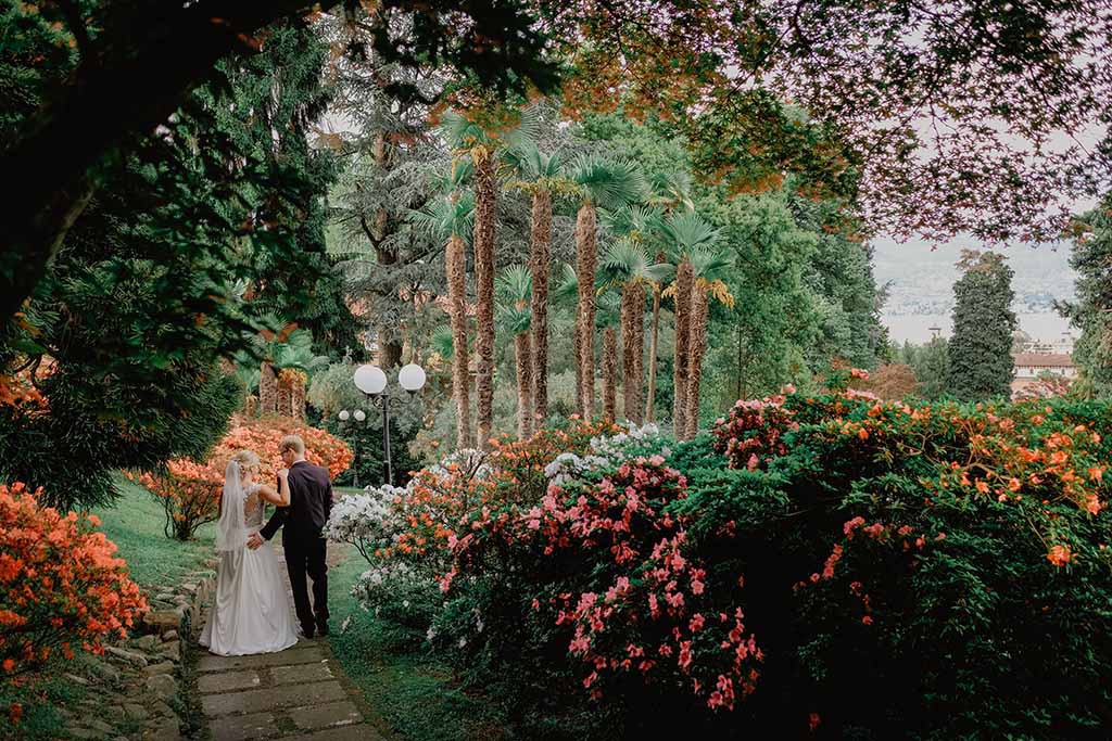 bridal couple in beautiful garden of villa on Lake Maggiore 